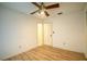 Bright bedroom with wood floors and ceiling fan at 832 S Hill Ave # 10, Deland, FL 32724