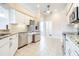 Kitchen features stainless steel appliances, granite countertops, and white cabinetry at 2636 Huntington Hills Dr, Lakeland, FL 33810
