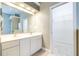 Double vanity bathroom with a walk-in closet at 2636 Huntington Hills Dr, Lakeland, FL 33810