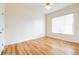 Bright bedroom featuring wood-look floors and a window at 2636 Huntington Hills Dr, Lakeland, FL 33810