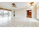 Spacious living room with tile floors and access to a screened porch at 2636 Huntington Hills Dr, Lakeland, FL 33810