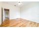 Simple bedroom with wood-look floors and access to hallway at 2636 Huntington Hills Dr, Lakeland, FL 33810