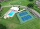 Aerial view of community pool, tennis courts, and clubhouse at 2636 Huntington Hills Dr, Lakeland, FL 33810