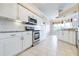 Kitchen boasts granite countertops, stainless steel appliances, and white cabinets at 2636 Huntington Hills Dr, Lakeland, FL 33810