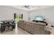 Living room with large sectional sofa and access to backyard at 266 Hyacinth Ct, Kissimmee, FL 34759