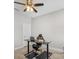 Functional home office featuring a standing desk, chair, and treadmill at 266 Hyacinth Ct, Kissimmee, FL 34759