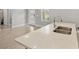 Modern kitchen island with quartz countertop and double sink at 266 Hyacinth Ct, Kissimmee, FL 34759