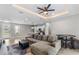 Open living room with sectional sofa, coffee table, and view into kitchen area at 266 Hyacinth Ct, Kissimmee, FL 34759