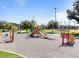 playground with slides, climbing structures, and a soft surface at 266 Hyacinth Ct, Kissimmee, FL 34759