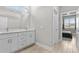 Clean bathroom with double vanity, view of bedroom, and updated fixtures at 266 Hyacinth Ct, Kissimmee, FL 34759