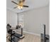 Home office with standing desk, ergonomic chair, and treadmill at 266 Hyacinth Ct, Kissimmee, FL 34759