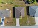 Three homes with similar architecture in a residential neighborhood at 266 Hyacinth Ct, Kissimmee, FL 34759