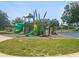 Playground with modern play structures and swings for children at 266 Hyacinth Ct, Kissimmee, FL 34759