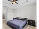 King-size bed, nightstands, and access to bathroom in this bright bedroom at 266 Hyacinth Ct, Kissimmee, FL 34759