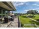 Enjoy morning coffee on this patio overlooking the golf course at 7330 Reflections Lake Dr, Lakeland, FL 33813
