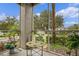Relaxing screened patio with table and chairs, offering a view of lush landscaping at 4255 Summer Landing Dr # 106, Lakeland, FL 33810
