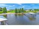 Tranquil waterfront property showcasing a home and private dock on a serene lake at 7884 N Lake Buffum Shores Rd, Fort Meade, FL 33841