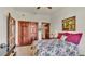 Bedroom with floral bedding and double doors at 7884 N Lake Buffum Shores Rd, Fort Meade, FL 33841