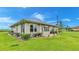 Exterior view of house with manicured lawn at 7884 N Lake Buffum Shores Rd, Fort Meade, FL 33841