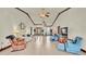Open-concept living area with high ceilings, comfortable furniture, and hardwood floors at 7884 N Lake Buffum Shores Rd, Fort Meade, FL 33841