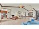 Bright living room showcasing an open floor plan and a view of the kitchen at 7884 N Lake Buffum Shores Rd, Fort Meade, FL 33841