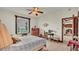 Comfortable bedroom with water views and built-in dresser at 7884 N Lake Buffum Shores Rd, Fort Meade, FL 33841