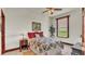 Bedroom with floral bedding and a view at 7884 N Lake Buffum Shores Rd, Fort Meade, FL 33841