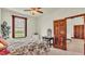 Bedroom with floral bedding and wood desk at 7884 N Lake Buffum Shores Rd, Fort Meade, FL 33841