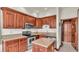 Well-equipped kitchen with wood cabinets and granite countertops at 7884 N Lake Buffum Shores Rd, Fort Meade, FL 33841