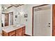 Bathroom with vanity and a door at 7884 N Lake Buffum Shores Rd, Fort Meade, FL 33841