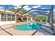 Large screened pool and spa with patio area at 3904 Cheverly E Dr, Lakeland, FL 33813