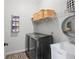 Laundry room with washer, dryer, shelving, and utility sink at 1096 Drew St, Lakeland, FL 33810