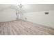 Spacious bonus room with light wood laminate flooring and recessed lighting at 1096 Drew St, Lakeland, FL 33810