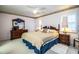 Spacious bedroom with king-size bed and wooden furniture at 6217 Crane Dr, Lakeland, FL 33809