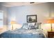 Serene bedroom with a queen-size bed, ceiling fan, and calm decor at 6217 Crane Dr, Lakeland, FL 33809