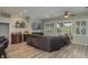 Gathering room with a large sectional sofa and flat screen tv at 6803 Hermitage Dr, Lakeland, FL 33810