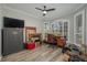 Home office with large windows and built-in shelving at 6803 Hermitage Dr, Lakeland, FL 33810