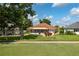 Single-story home with screened patio, situated on a golf course at 6803 Hermitage Dr, Lakeland, FL 33810