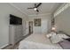 Comfortable bedroom with a ceiling fan and hardwood floors at 6803 Hermitage Dr, Lakeland, FL 33810