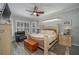 Main bedroom with a king-size bed and large windows at 6803 Hermitage Dr Dr, Lakeland, FL 33810