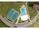 Aerial view of community tennis courts and pool at 6803 Hermitage Dr, Lakeland, FL 33810