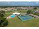 Community pool and tennis courts near clubhouse at 6803 Hermitage Dr, Lakeland, FL 33810