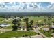 Aerial view of home in a golf course community near pool and tennis at 6803 Hermitage Dr, Lakeland, FL 33810