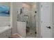 Modern bathroom with a large glass shower and marble tile at 6803 Hermitage Dr, Lakeland, FL 33810