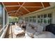 Covered patio with seating area, perfect for outdoor relaxation at 6803 Hermitage Dr, Lakeland, FL 33810