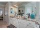 Double vanity bathroom with granite countertops and updated fixtures at 6803 Hermitage Dr, Lakeland, FL 33810