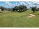 Aerial view of a golf course putting green at 6803 Hermitage Dr, Lakeland, FL 33810