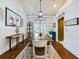 Farmhouse-style dining room with wooden table and built-in bar at 1323 Hammock Shade Dr, Lakeland, FL 33809