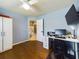 Bright bedroom with hardwood floors and a built-in home office at 1323 Hammock Shade Dr, Lakeland, FL 33809
