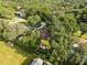 Aerial view of a house nestled in a lush, green neighborhood at 1323 Hammock Shade Dr, Lakeland, FL 33809
